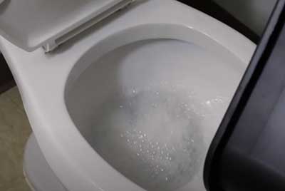 uncloging toilet with hot water and dish soap