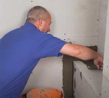 guy installing cement board