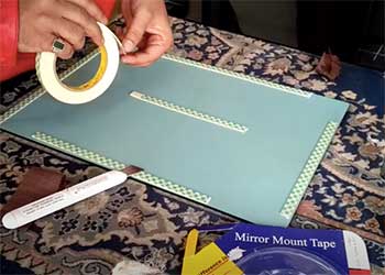 hang a mirror with mounting tape