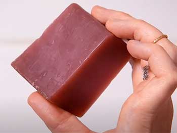 guy holding lush Soap