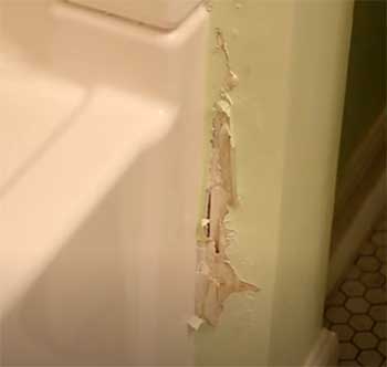water damaged drywall around shower